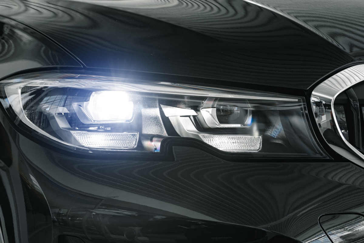 headlights new white luxury car close up 800